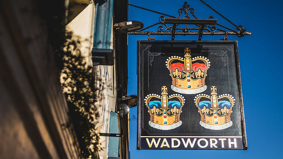 The Three Crowns pub signage